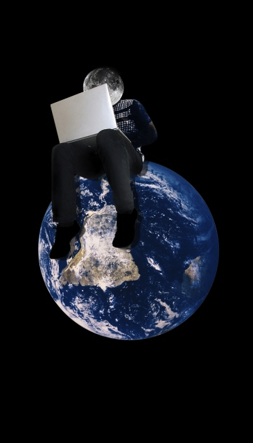 a laptop sits astride the world, representing the global nature of information today