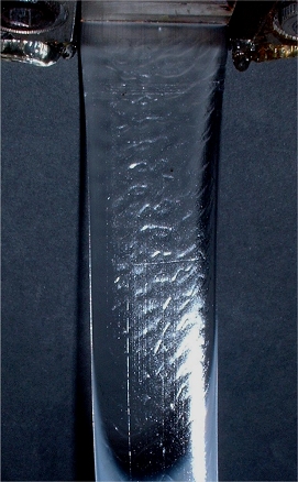 Unstable flow of a
molten polymer